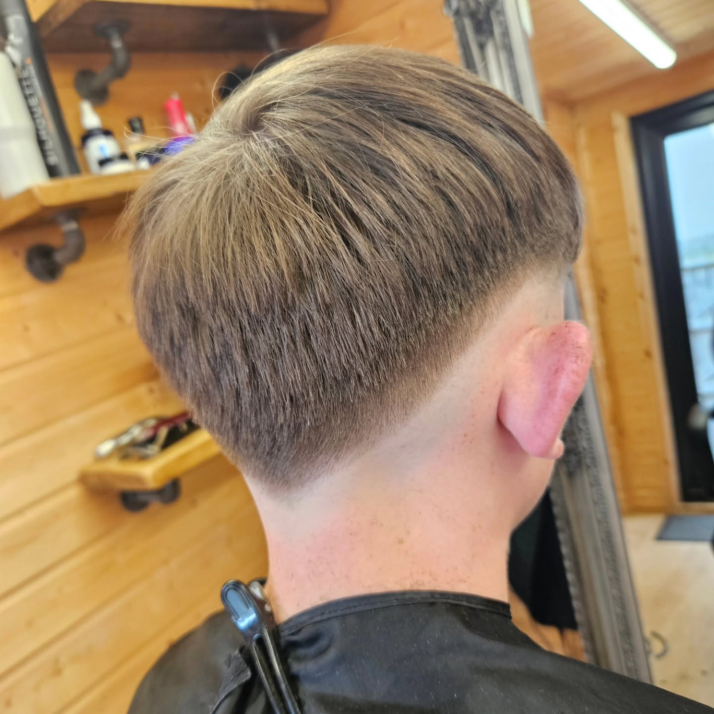 Low fade with scissor work on top